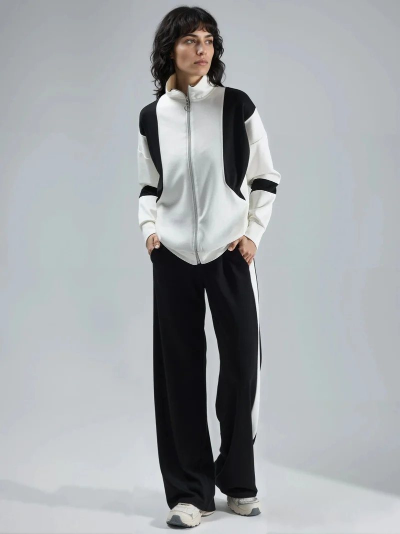 هيكاب طقم قطعتين من مجموعة بيرسان بنقوش لونية وياقة بسحاب وأرجل واسعة